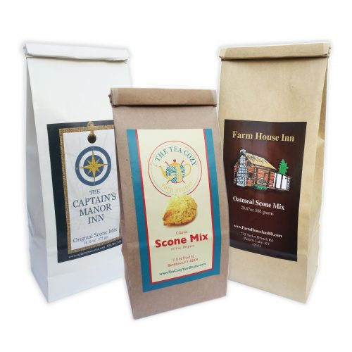 Three different bags of wholesale scone mix, with different bag sizes, colors, and private labels created for three unique businesses