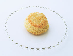 Cornmeal biscuit isolated on glass plate.