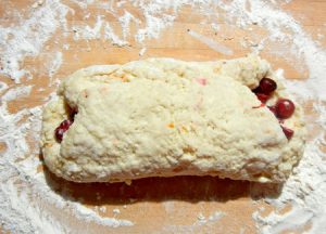 Scone dough folded over cranberries